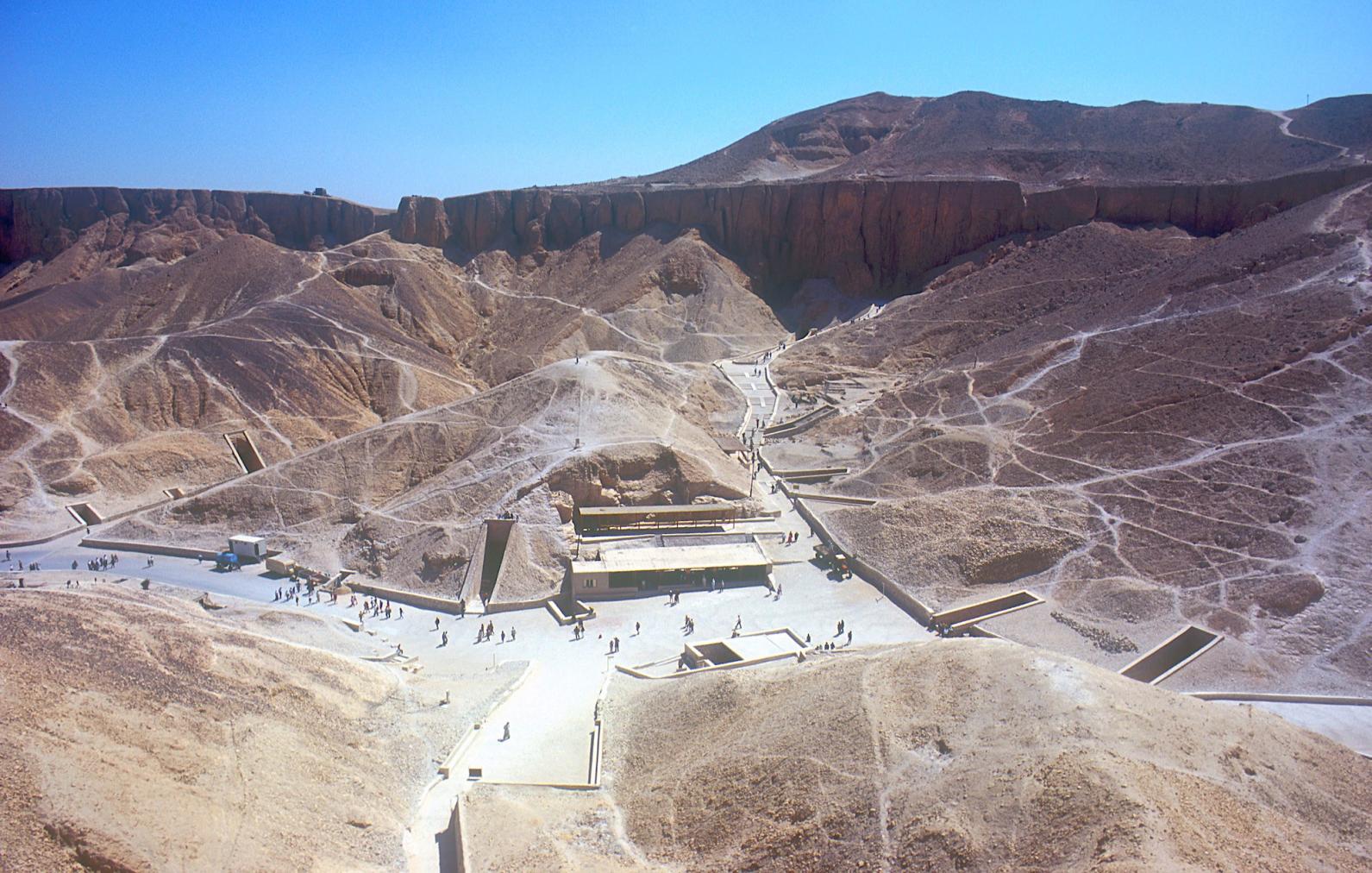 Valley of the Kings, cliff above KV 8, looking east; entrances to KV 03, KV 46, KV 04, KV 05, KV 06, KV 55, KV 62, KV 19, KV 18, KV 17, KV 16, KV 10, KV 11 and tourist shelter.