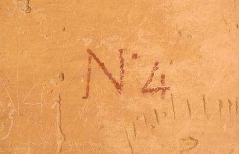 Wilkinson's painted tomb number and graffiti.