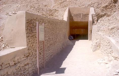 Modern approach to tomb entrance, with old information sign.