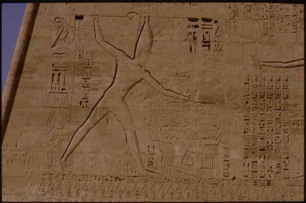 Rameses III Memorial temple, first pylon south wing east face, detail: King smiting enemies.
