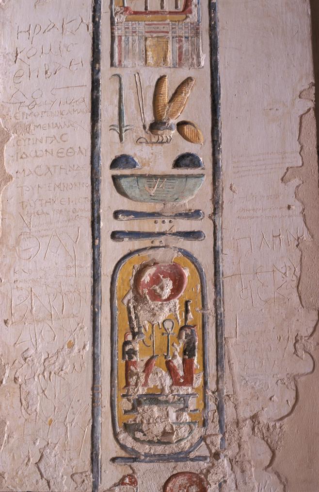 Detail of cartouche of Ramesses VI carved over cartouche of Ramesses V; Greek visitors' graffiti to each side (Baillet, 1282-1301).