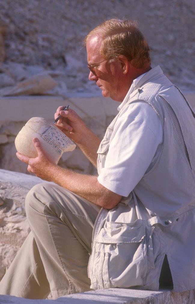 Dr. Kent Weeks inspecting a canopic jar.